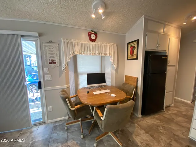 a dining room with furniture and window
