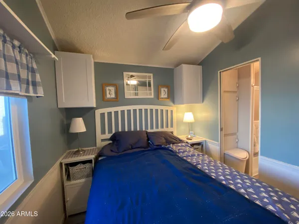 a bedroom with furniture and a window