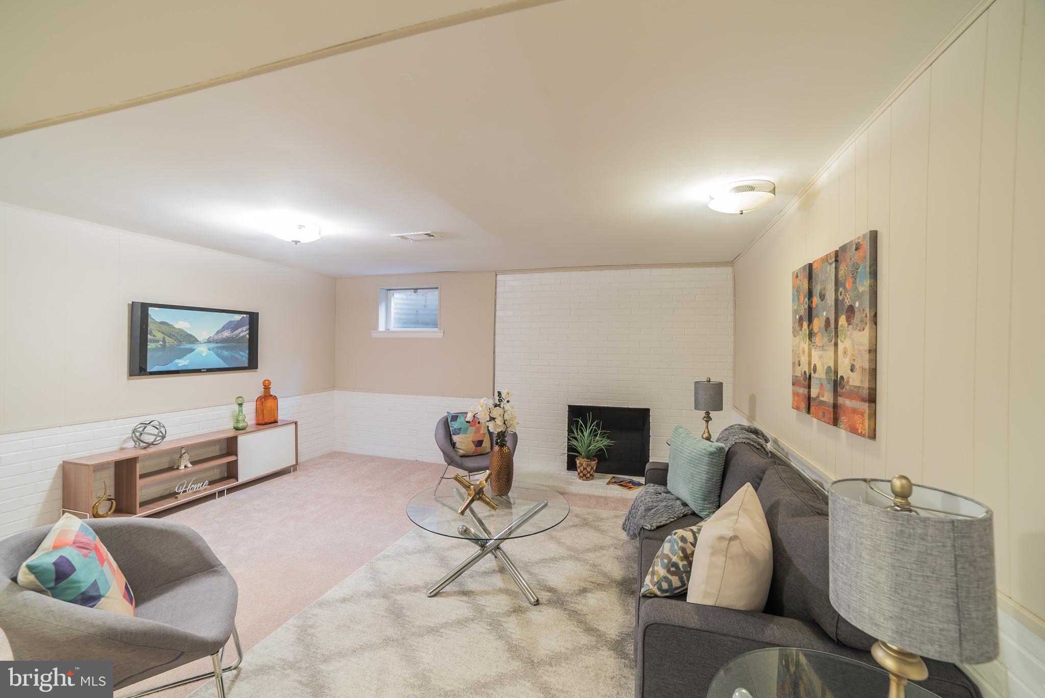 13616 Wendover Road Silver Spring, MD 20904 - Photo 23 of 30 Lower level recreation room with second fireplace