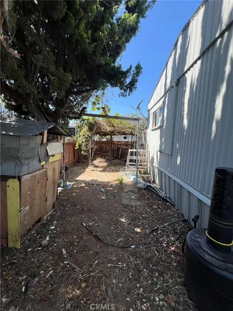 a view of a backyard with sitting area