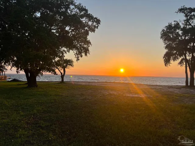 a view of an ocean and yard