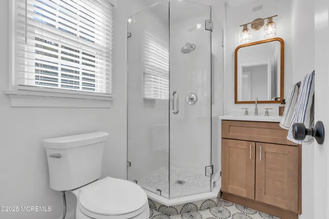 a bathroom with a toilet sink and shower