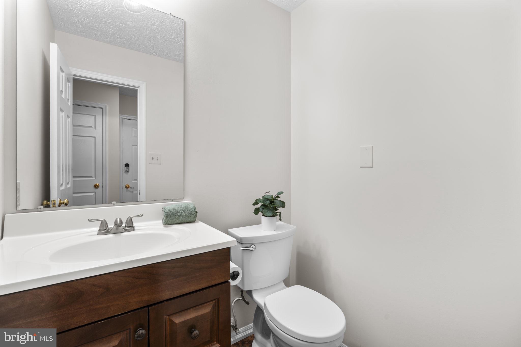6241 Martin Road Columbia, MD 21044 - Photo 20 of 53 a bathroom with a sink vanity mirror and toilet