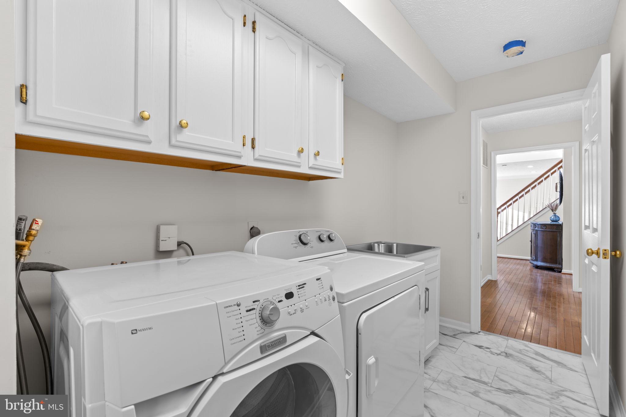 6241 Martin Road Columbia, MD 21044 - Photo 21 of 53 a utility room with dryer and washer
