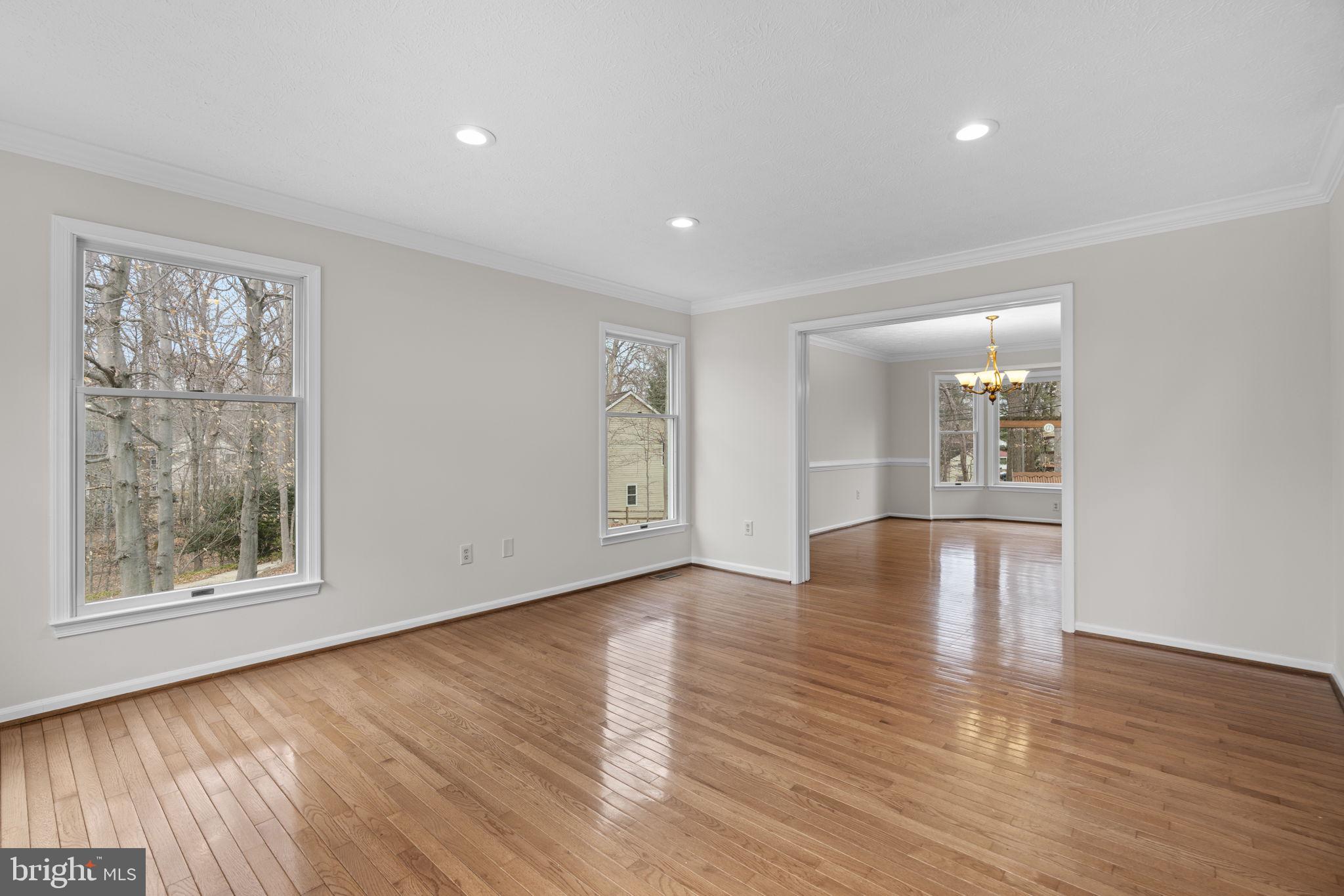6241 Martin Road Columbia, MD 21044 - Photo 7 of 53 a view of an empty room with wooden floor and a window