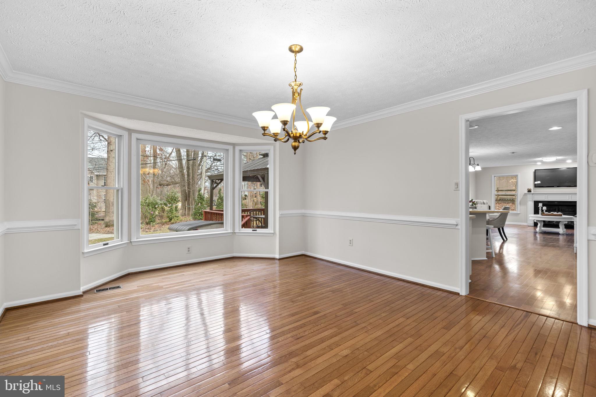 6241 Martin Road Columbia, MD 21044 - Photo 9 of 53 a view of an empty room with wooden floor and a window