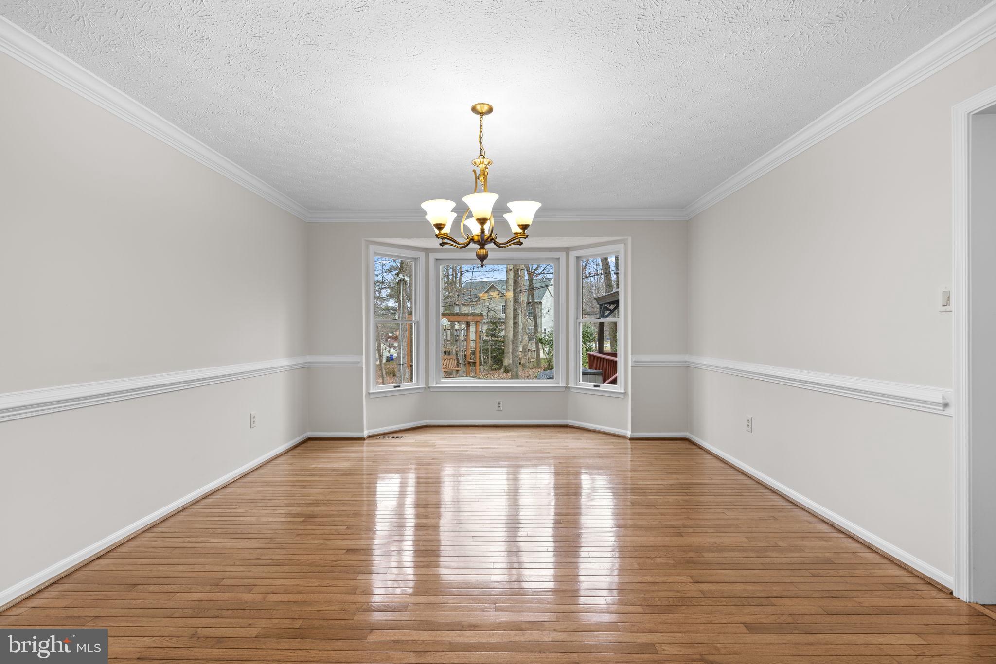 6241 Martin Road Columbia, MD 21044 - Photo 10 of 53 a view of an empty room with window and wooden floor