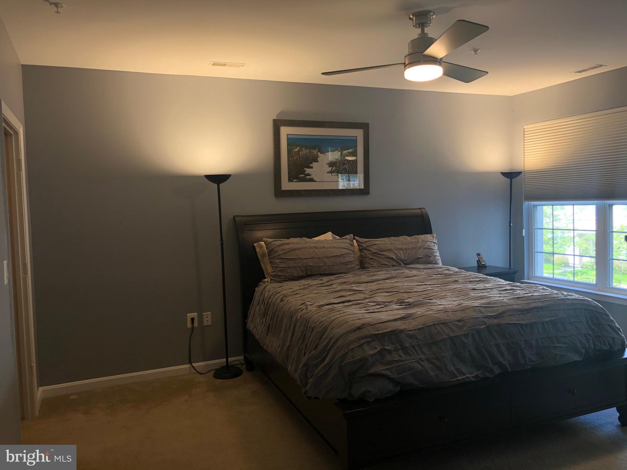 400 Symphony Circle, Unit 354D Cockeysville, MD 21030 - Photo 10 of 33 a bedroom with a bed and a window