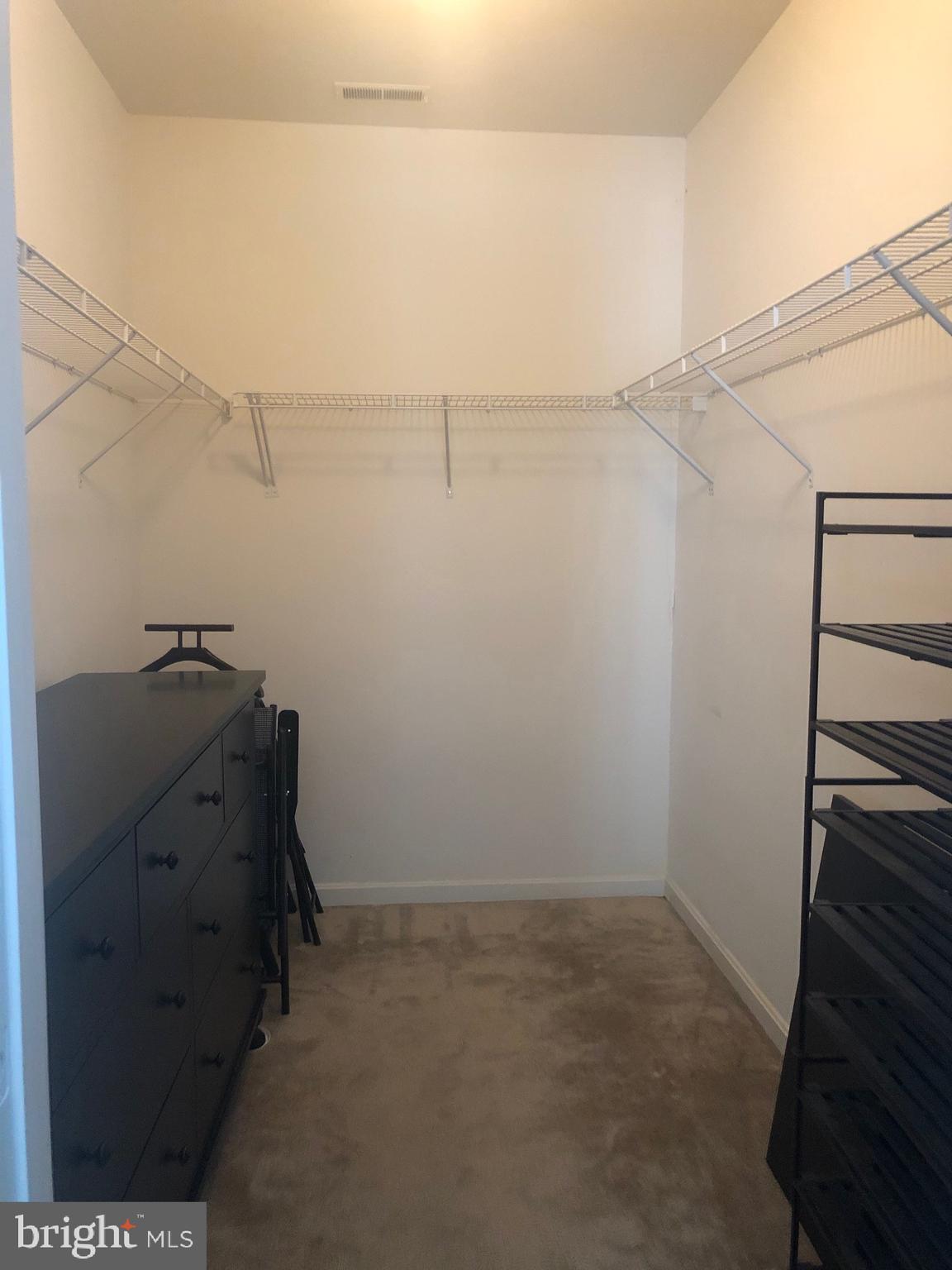 400 Symphony Circle, Unit 354D Cockeysville, MD 21030 - Photo 11 of 33 a view of storage and utility room with racks on the wall