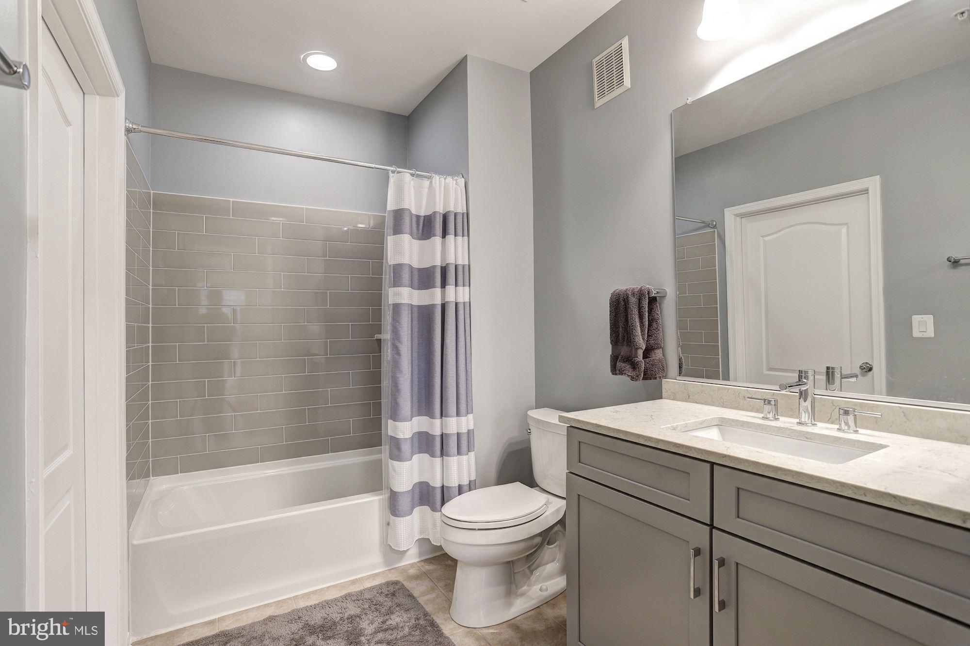 400 Symphony Circle, Unit 354D Cockeysville, MD 21030 - Photo 17 of 33 a bathroom with a sink toilet and shower