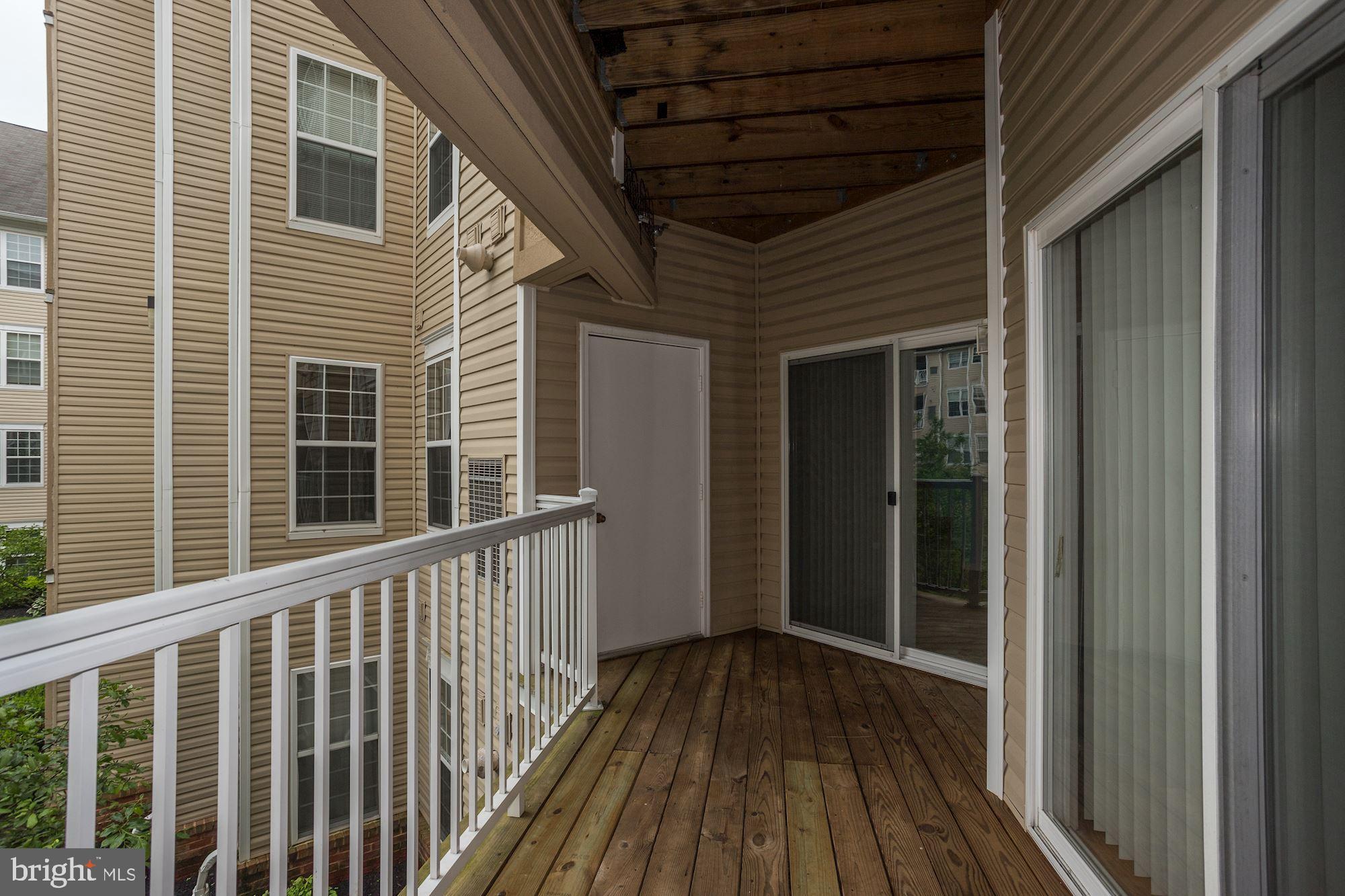 400 Symphony Circle, Unit 354D Cockeysville, MD 21030 - Photo 2 of 33 a view of a house with wooden floor
