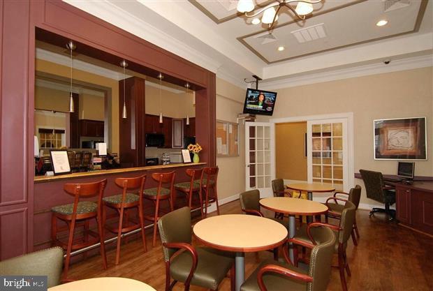 400 Symphony Circle, Unit 354D Cockeysville, MD 21030 - Photo 23 of 33 a dining room with furniture a chandelier and window