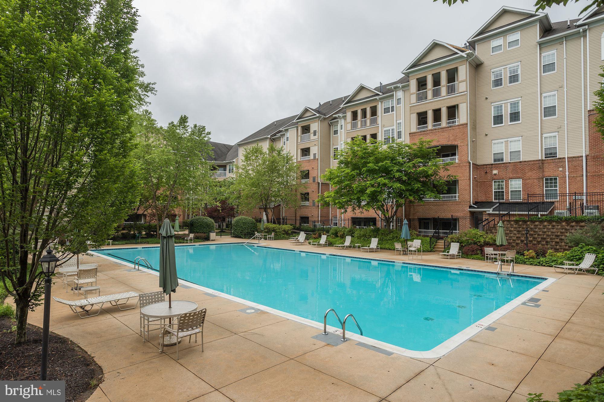 400 Symphony Circle, Unit 354D Cockeysville, MD 21030 - Photo 27 of 33 a view of a swimming pool with a patio