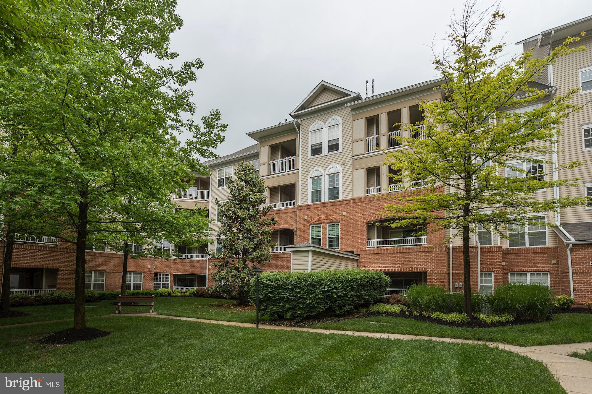 400 Symphony Circle, Unit 354D Cockeysville, MD 21030 - Photo 30 of 33 front view of a house with a yard