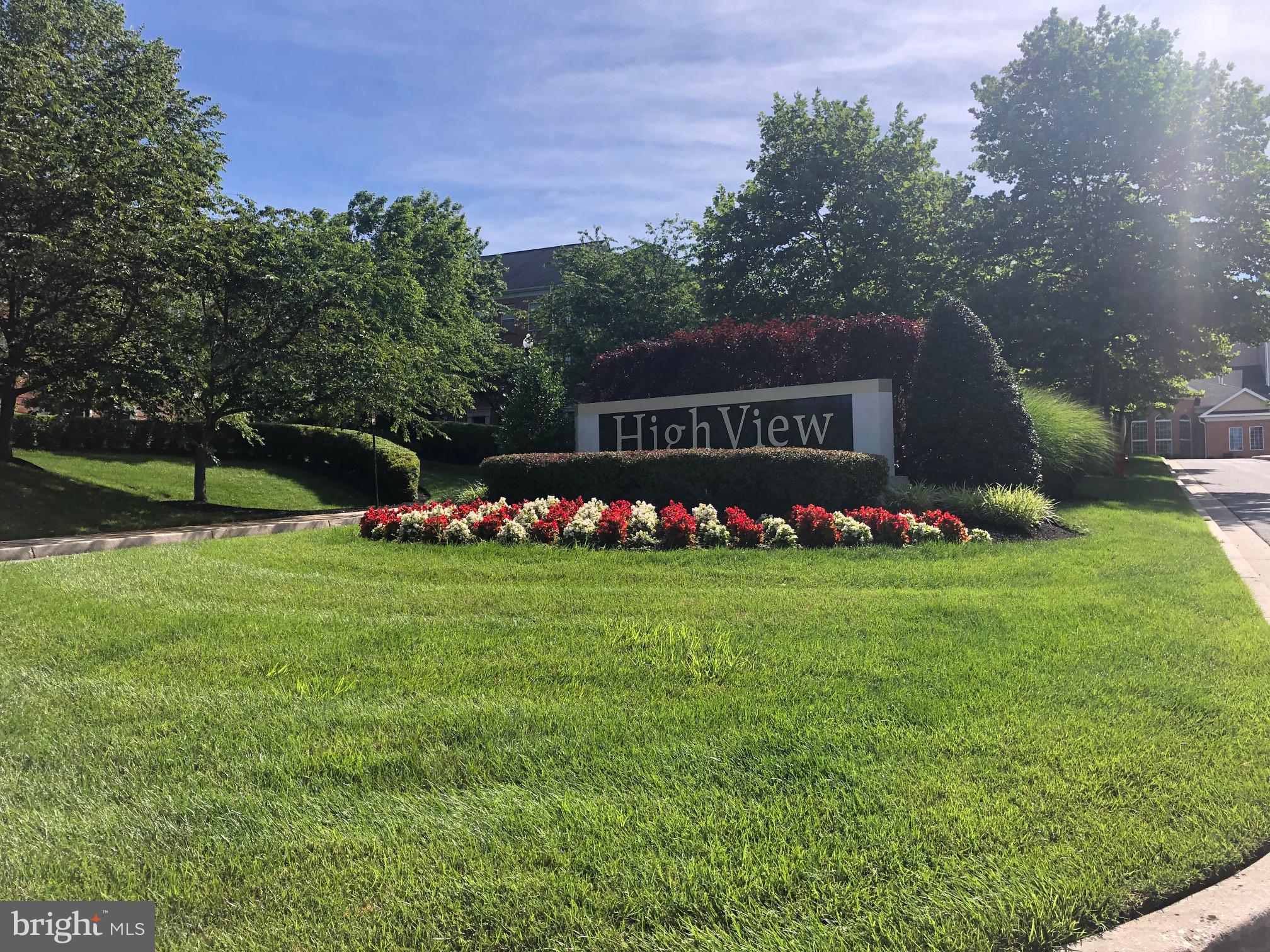 400 Symphony Circle, Unit 354D Cockeysville, MD 21030 - Photo 31 of 33 a front view of a house with garden