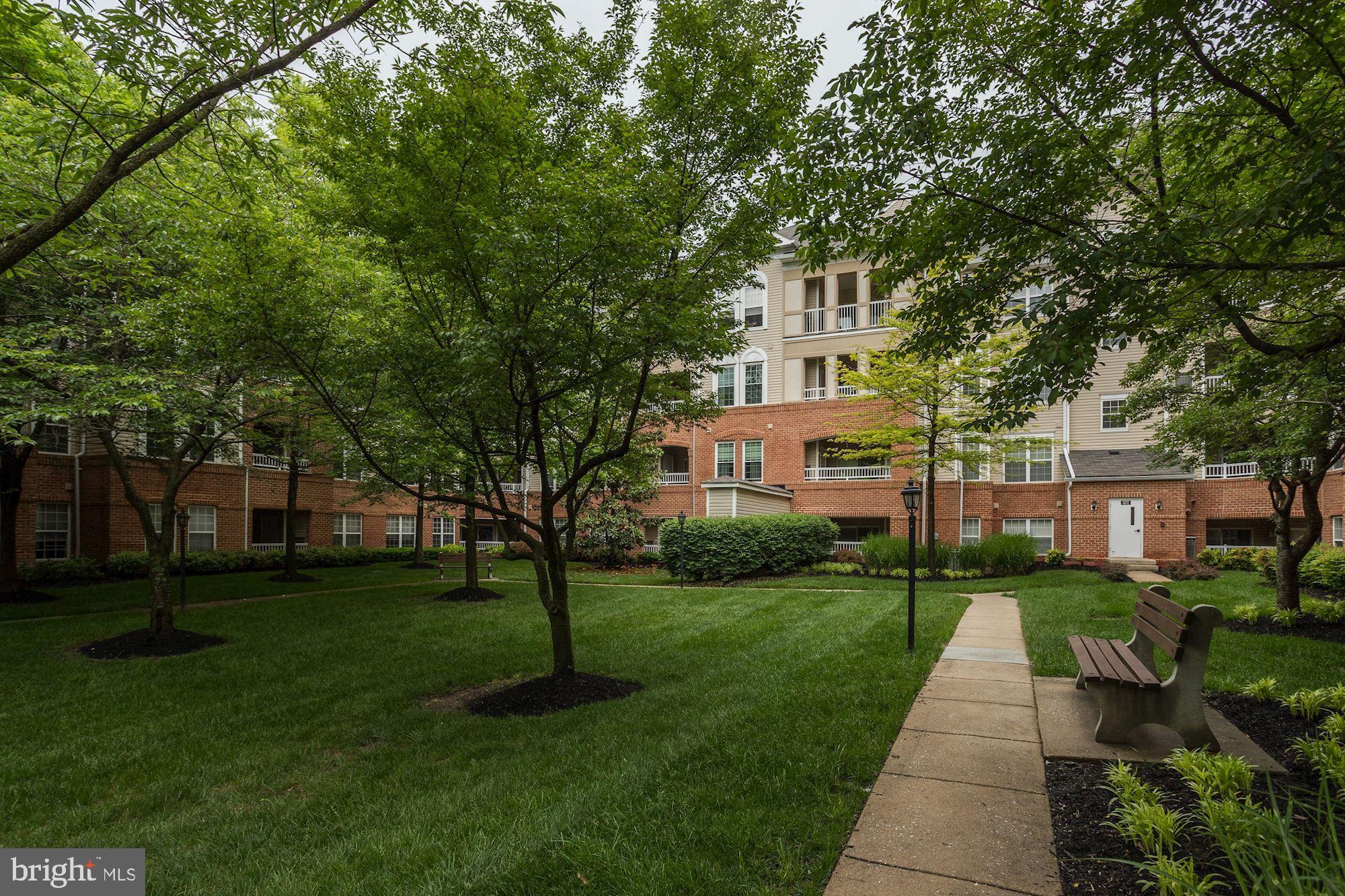 400 Symphony Circle, Unit 354D Cockeysville, MD 21030 - Photo 32 of 33 a view of a house with a yard