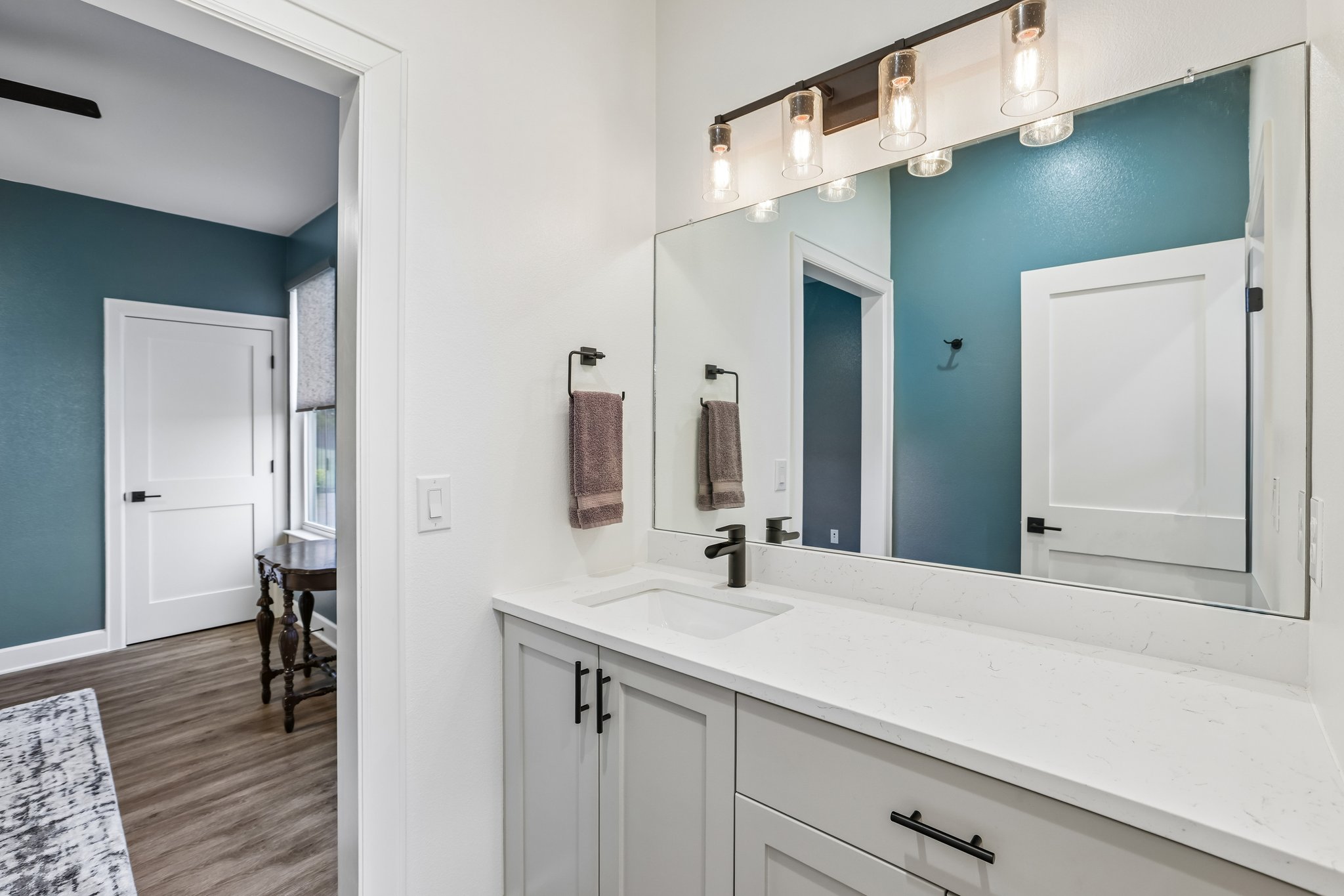 113 Crystal Lane Georgetown, TX 78633 - Photo 27 of 32 A well-appointed bathroom vanity with a clean white countertop and ample storage.