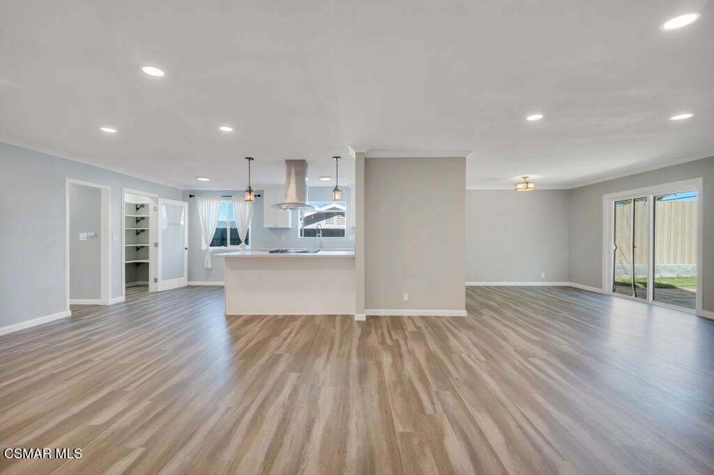 896 Moffatt Circle Simi Valley, CA 93065 - Photo 11 of 50 a view of a big room with wooden floor and windows