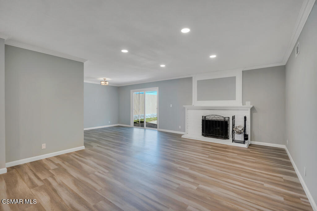 896 Moffatt Circle Simi Valley, CA 93065 - Photo 12 of 50 a view of empty room with wooden floor and fireplace