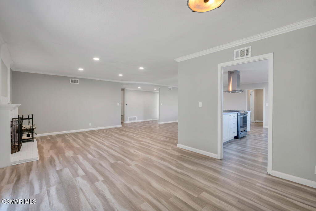 896 Moffatt Circle Simi Valley, CA 93065 - Photo 16 of 50 a view of an empty room with wooden floor and a window