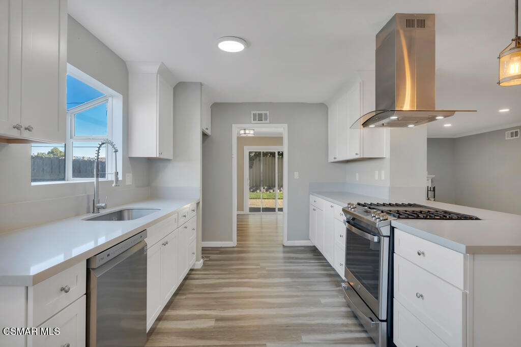 896 Moffatt Circle Simi Valley, CA 93065 - Photo 19 of 50 a kitchen with a stove and a sink
