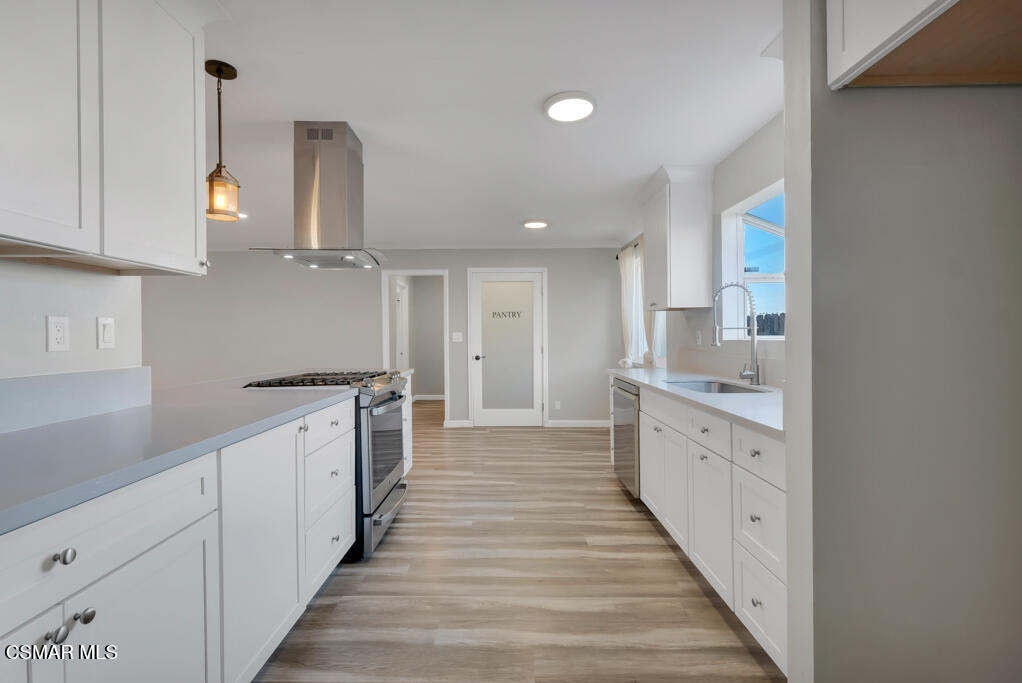 896 Moffatt Circle Simi Valley, CA 93065 - Photo 22 of 50 a large kitchen with cabinets