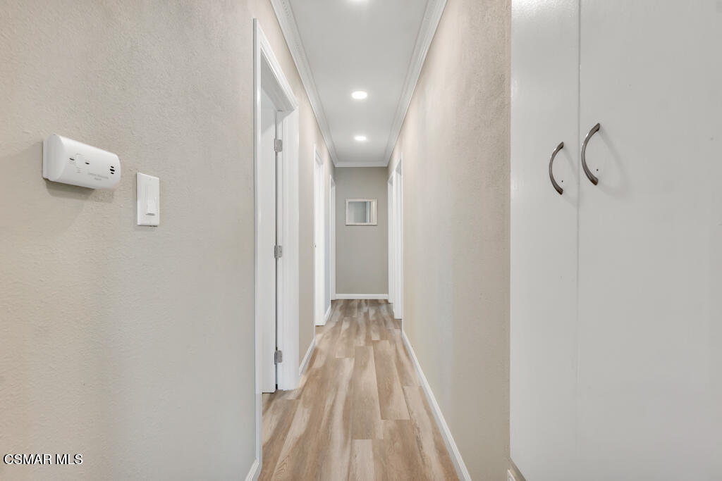 896 Moffatt Circle Simi Valley, CA 93065 - Photo 30 of 50 a view of a hallway with wooden floor and closet