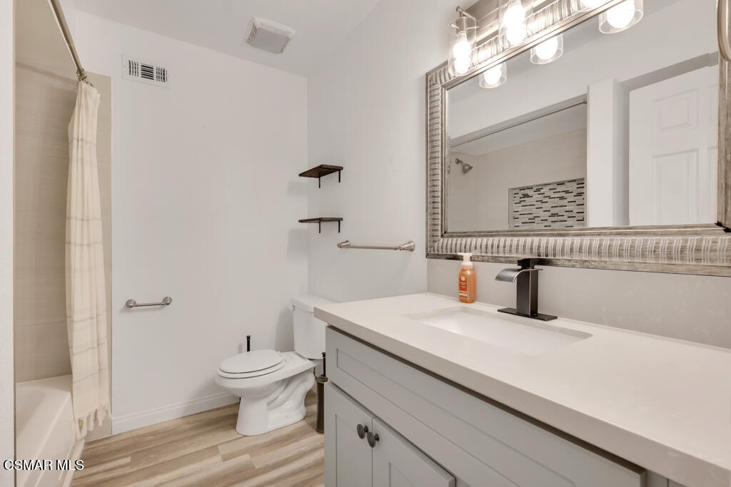 896 Moffatt Circle Simi Valley, CA 93065 - Photo 33 of 50 a bathroom with a sink a toilet and a mirror