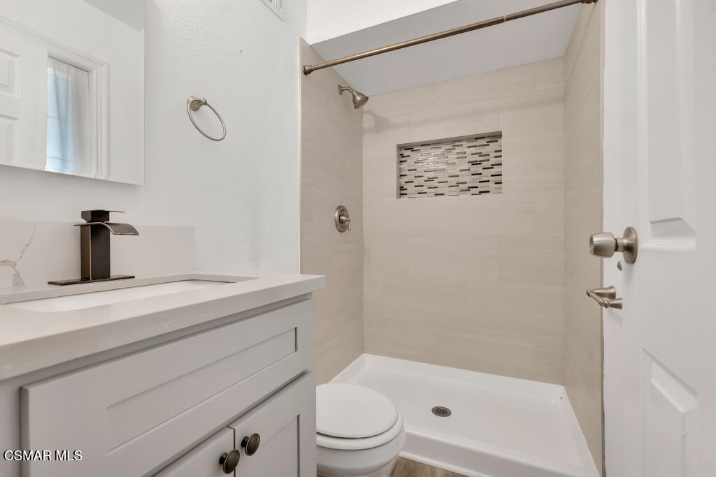 896 Moffatt Circle Simi Valley, CA 93065 - Photo 38 of 50 a bathroom with a sink a toilet and shower