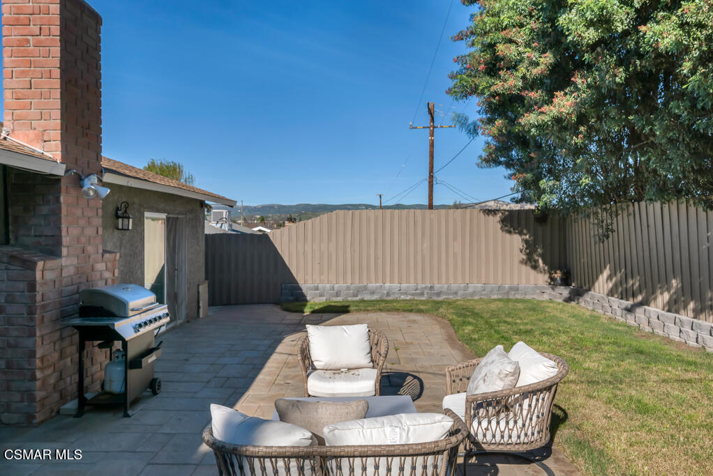 896 Moffatt Circle Simi Valley, CA 93065 - Photo 45 of 50 a backyard of a house with table and chairs