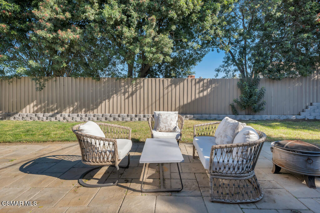 896 Moffatt Circle Simi Valley, CA 93065 - Photo 46 of 50 a view of a chairs and table in backyard