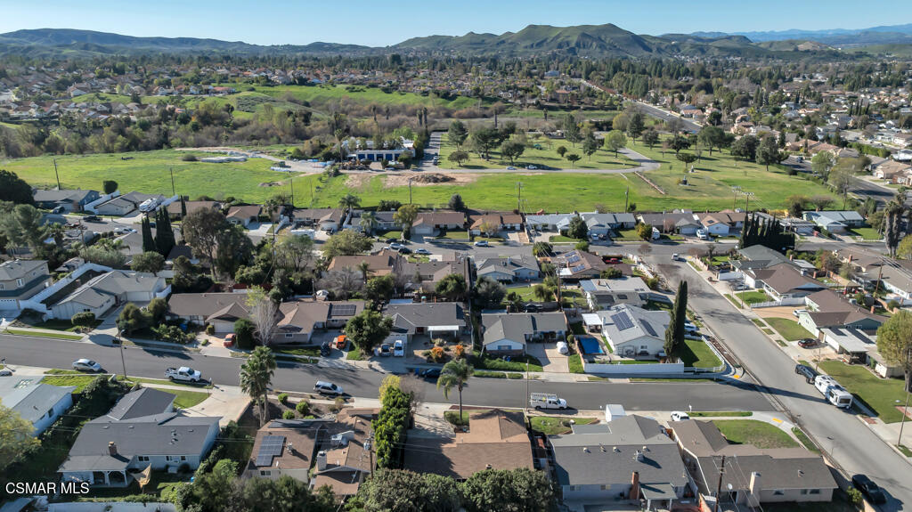 896 Moffatt Circle Simi Valley, CA 93065 - Photo 48 of 50 an aerial view of a city with lots of residential buildings and mountain view in back