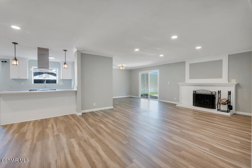 896 Moffatt Circle Simi Valley, CA 93065 - Photo 6 of 50 a view of empty room with wooden floor and fireplace