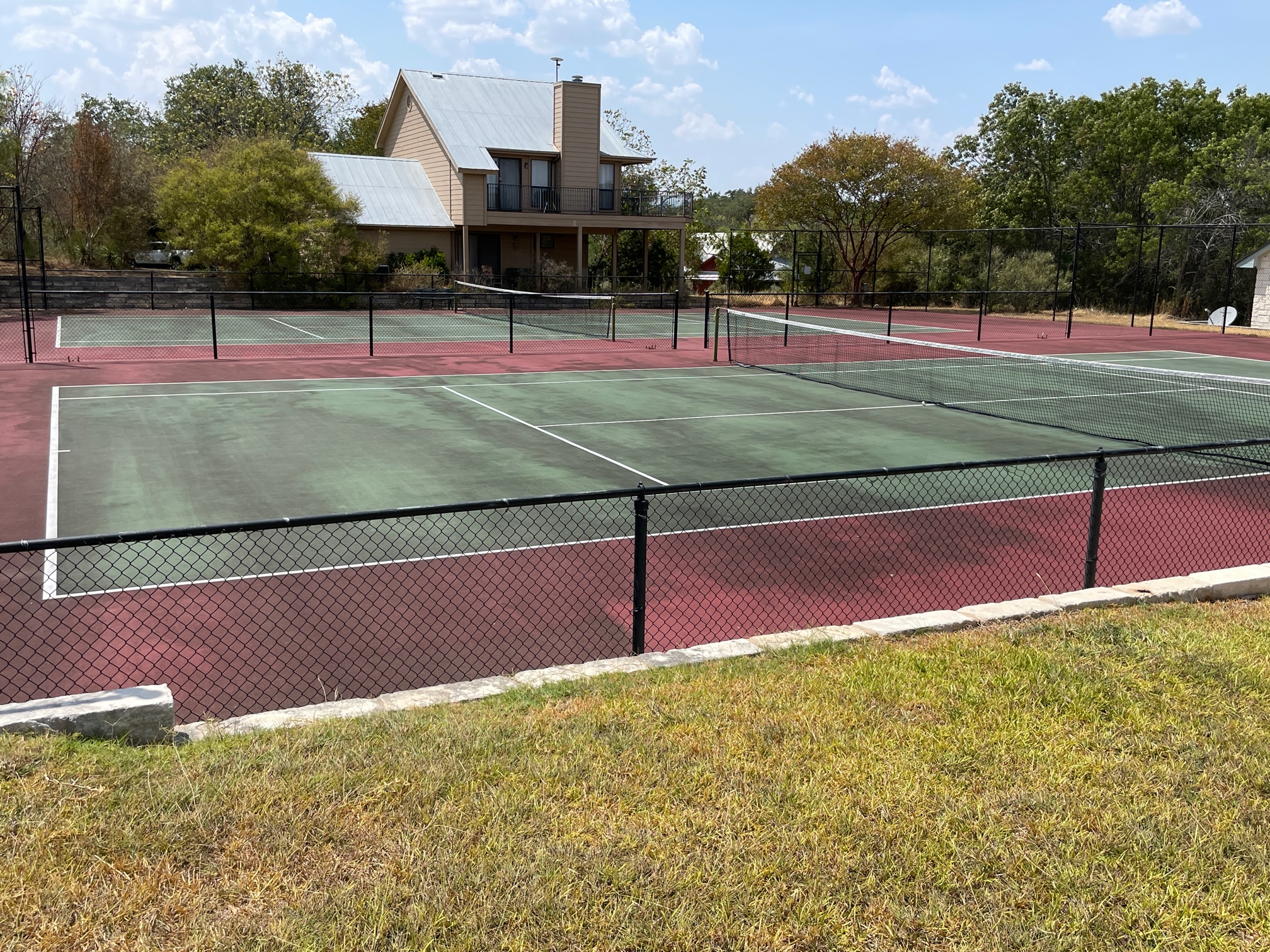 Lot 80 Wesley Ridge Drive Spicewood, TX 78669 - Photo 8 of 12 a view of a tennis court