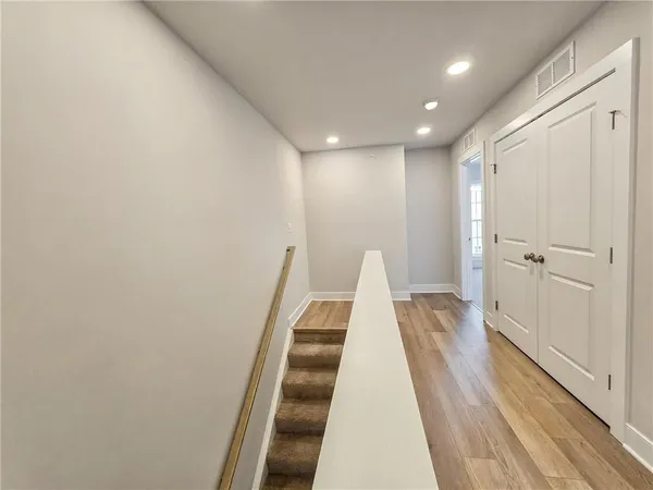 a bathroom with a sink a toilet and a large mirror