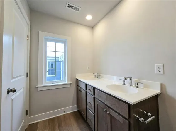a view of a swimming pool and lounge chairs
