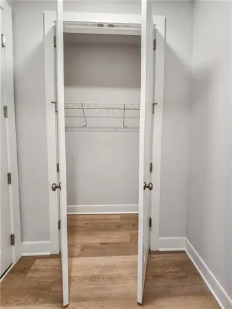 a bathroom with a sink toilet vanity and shower