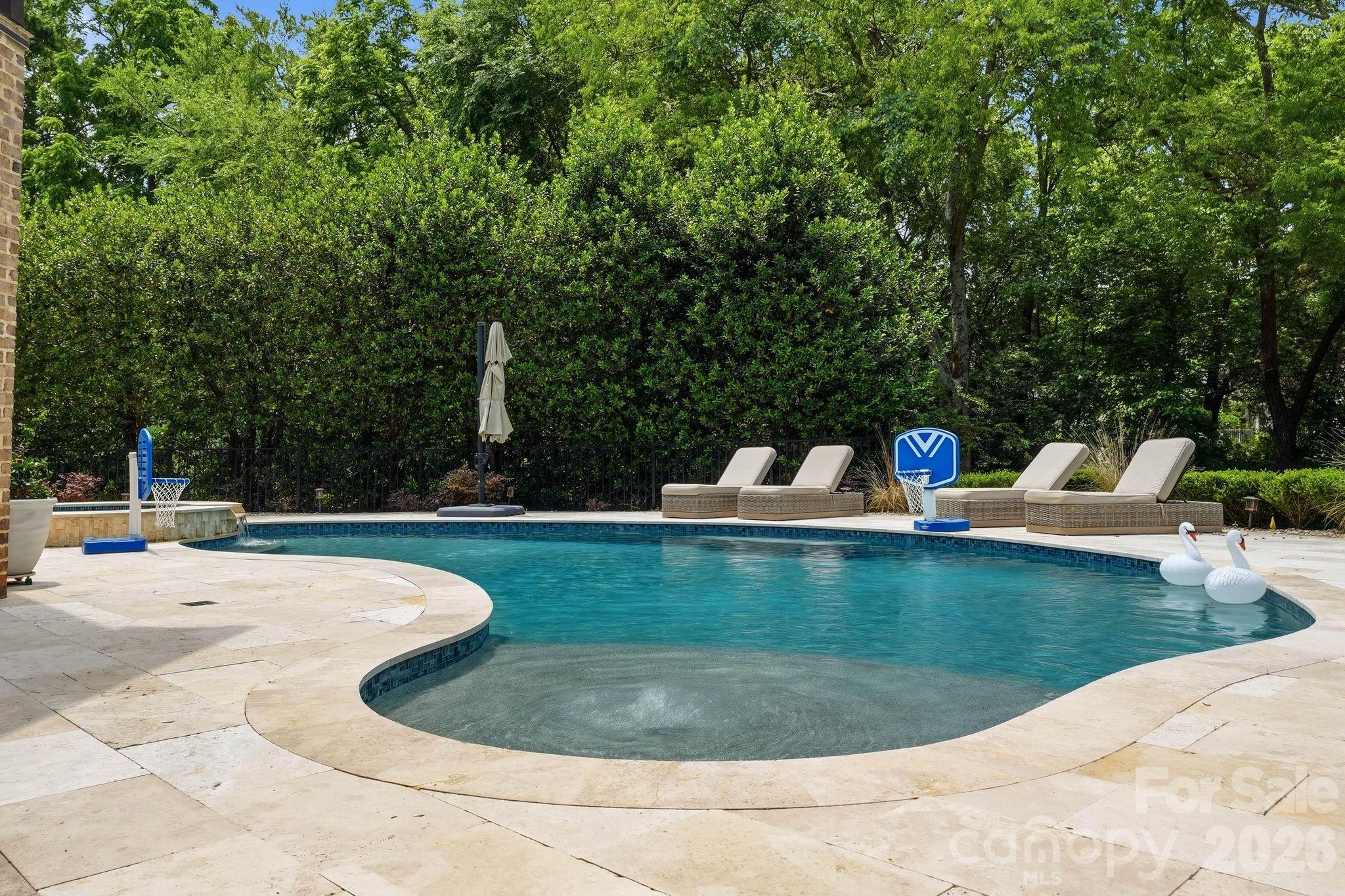 7416 Lee Rea Road Charlotte, NC 28226 - Photo 10 of 48 a view of a swimming pool with a sitting space