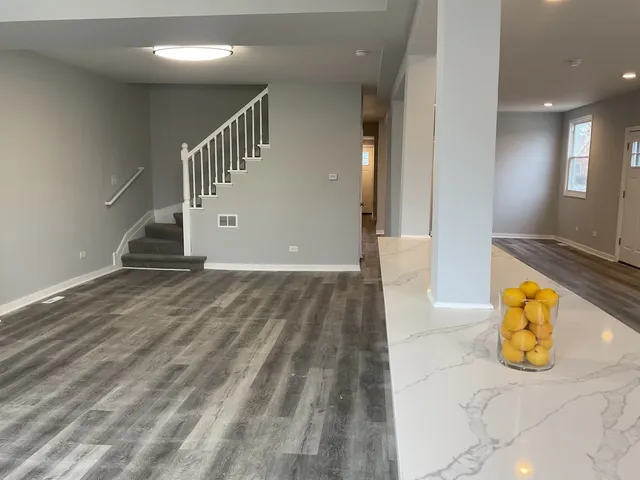 a kitchen with sink and cabinets