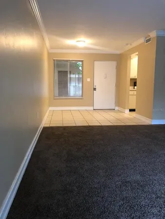 a kitchen with white cabinets and a sink