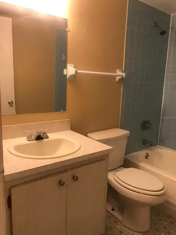 a bathroom with a toilet and shower