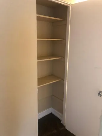 an empty room with closet
