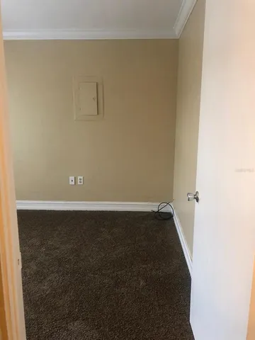 a view of empty room with closet