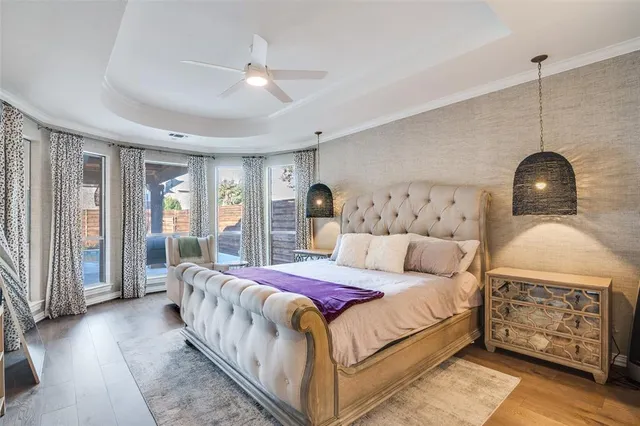 a bedroom with a large bed and a window