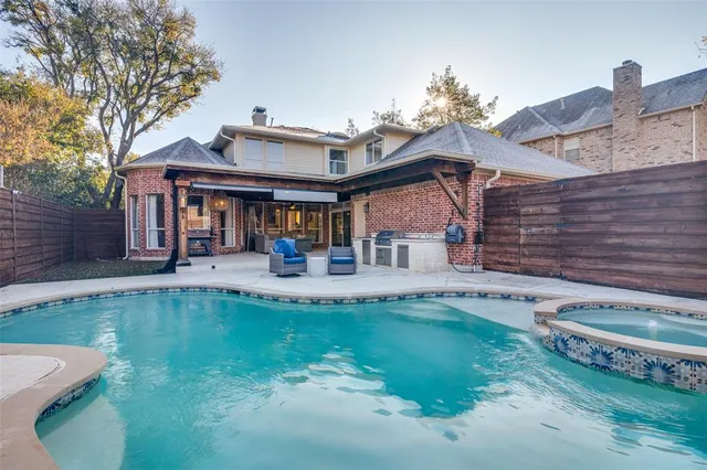 a view of a house with pool yard and a patio
