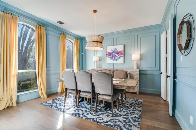 a dining room with furniture window chandelier