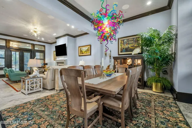 a kitchen with stainless steel appliances granite countertop a sink and a large window