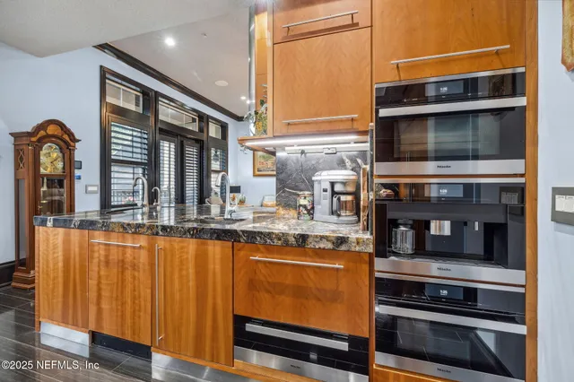 a work room with furniture and a flat screen tv