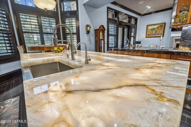 a bedroom with a bed window and a flat screen tv