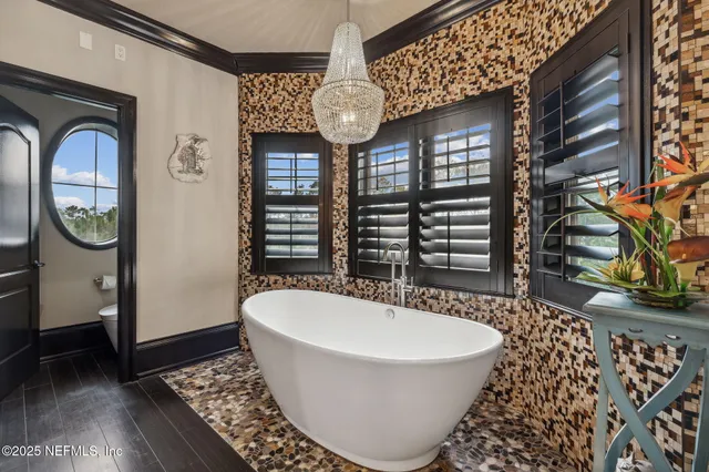 a front view of a building with a garden